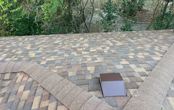 Steep hip ridge of a February 2026 roof replacement in west Houston