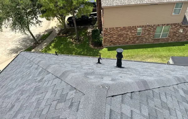 Front slope and ridge caps of the completed roof, Cypress 77433