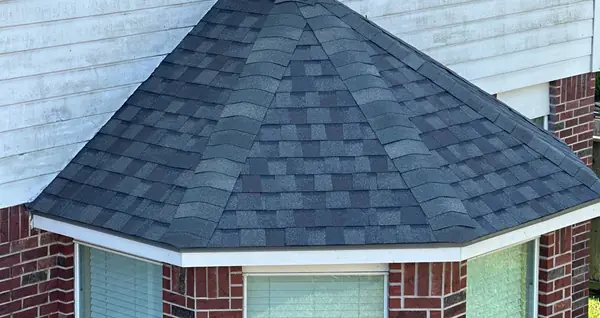 Bay window roof with fresh shingles in Pearland