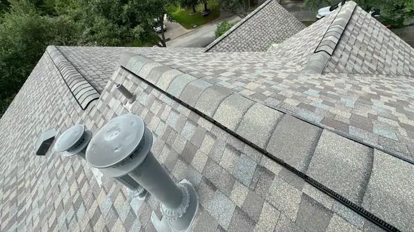 Replaced pipe jacks and ridge on a November 2025 storm restoration roof