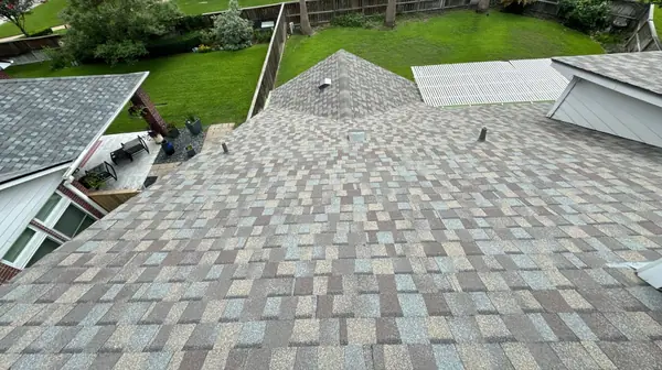 Rear slope of a new roof over a Houston backyard